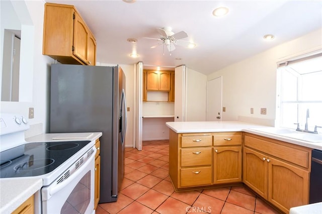 kitchen featuring light tile patterned flooring, white electric range oven, sink, kitchen peninsula, and ceiling fan