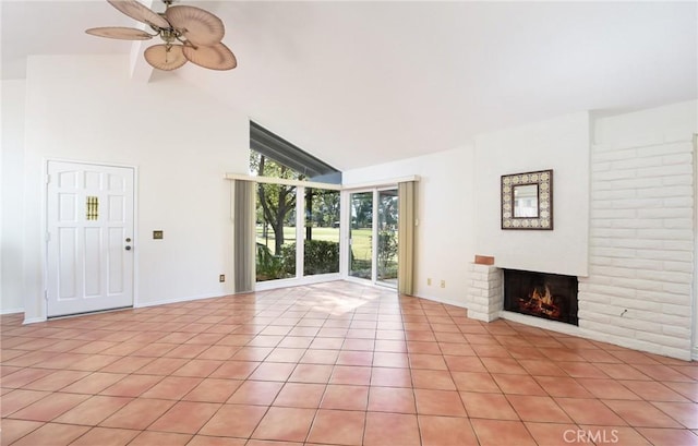 unfurnished living room featuring ceiling fan, a fireplace, high vaulted ceiling, and light tile patterned floors