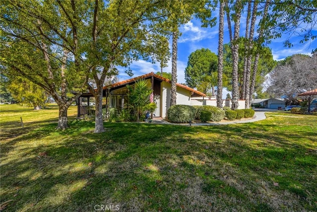 view of home's exterior with a lawn