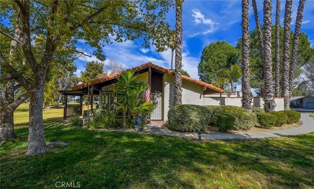 exterior space featuring a front lawn