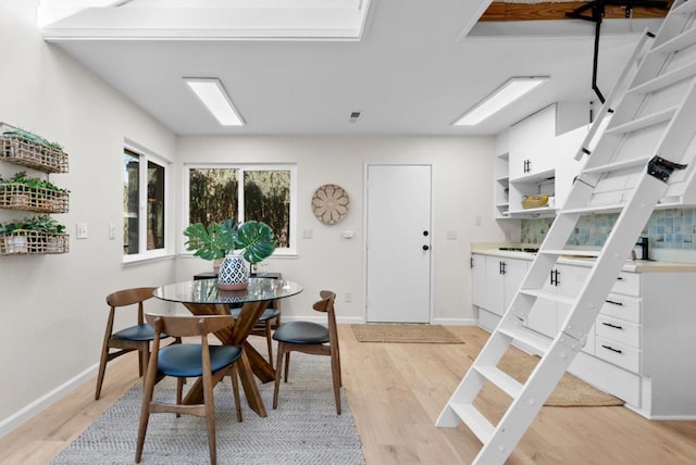 dining room with light hardwood / wood-style flooring