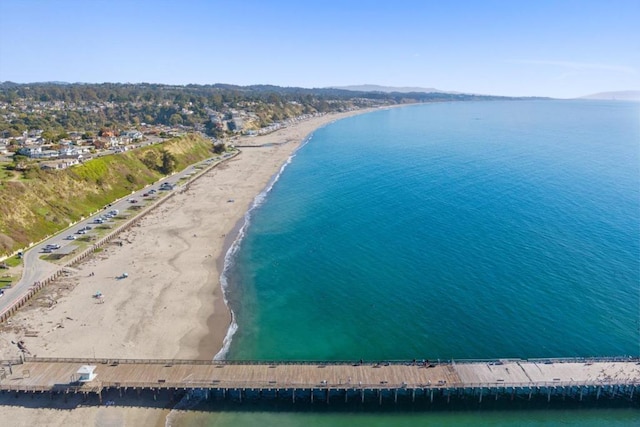 aerial view featuring a water view and a beach view