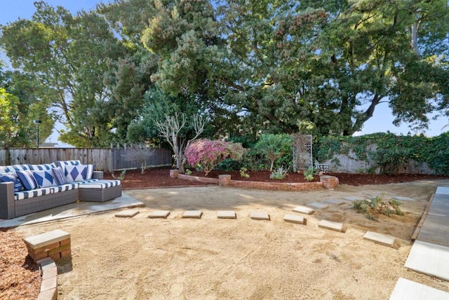 view of yard featuring an outdoor living space and a patio