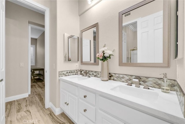 bathroom with vanity and hardwood / wood-style floors