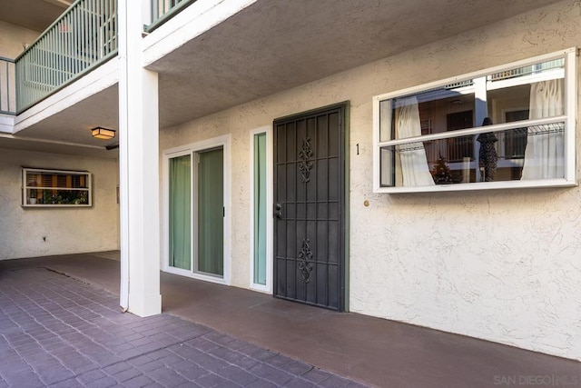 property entrance with a patio