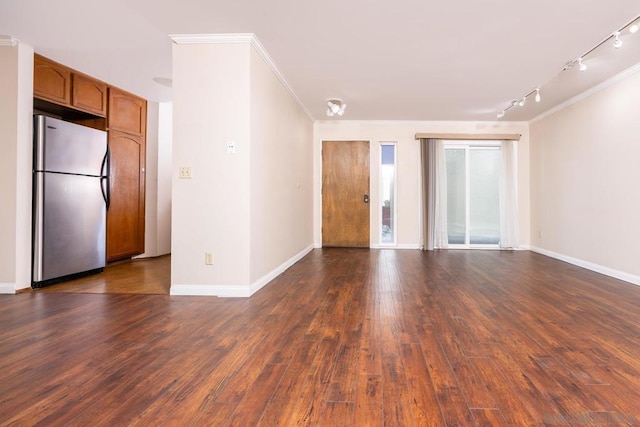 unfurnished room featuring ornamental molding and dark wood-type flooring