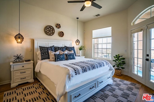 bedroom with french doors, ceiling fan, wood-type flooring, and access to exterior