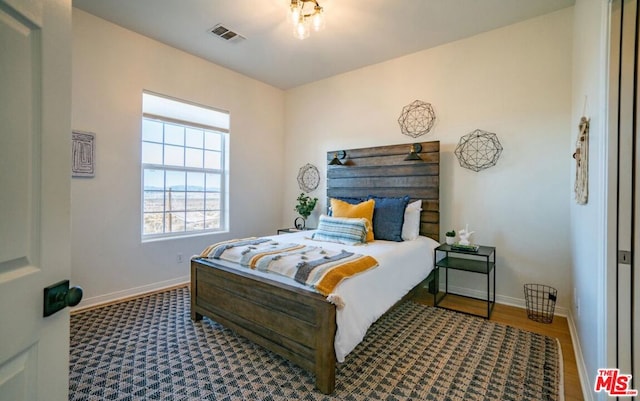 bedroom featuring wood-type flooring