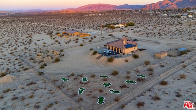 aerial view at dusk with a mountain view