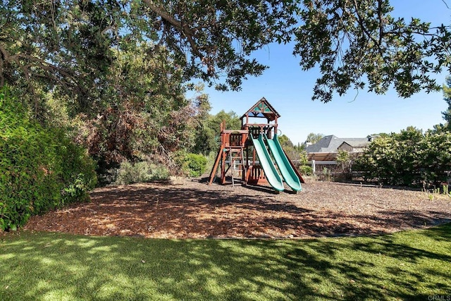 view of jungle gym with a lawn