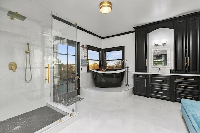 bathroom featuring vanity, crown molding, and separate shower and tub