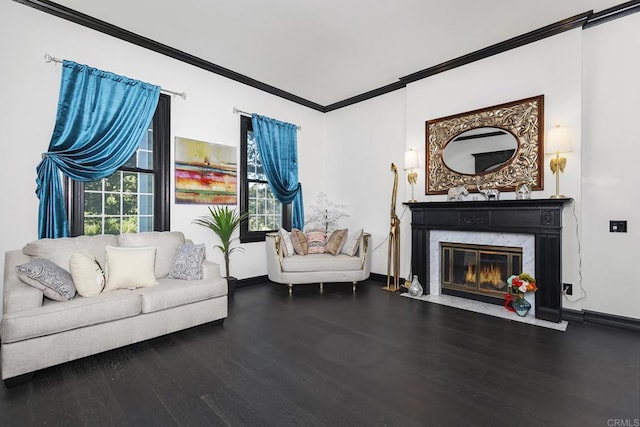 living room featuring crown molding, a high end fireplace, and dark hardwood / wood-style flooring