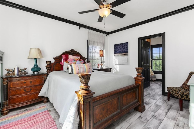 bedroom with crown molding, light hardwood / wood-style floors, and ceiling fan