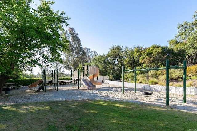 view of jungle gym featuring a lawn