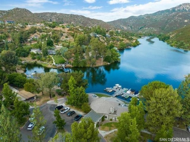 aerial view featuring a water and mountain view