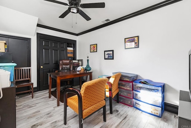 office featuring light hardwood / wood-style flooring, ornamental molding, and ceiling fan