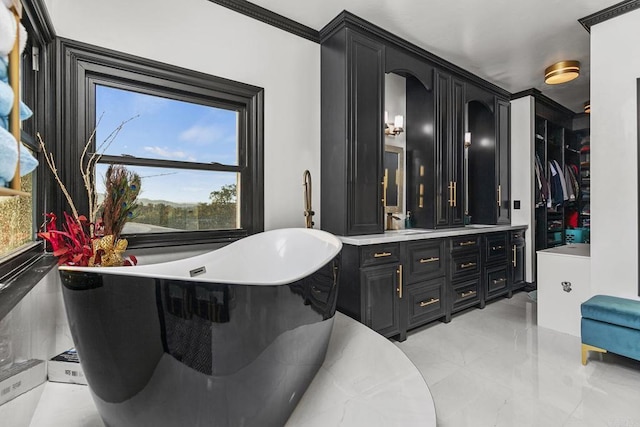 bathroom with vanity and a tub to relax in