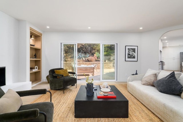 living room featuring built in shelves