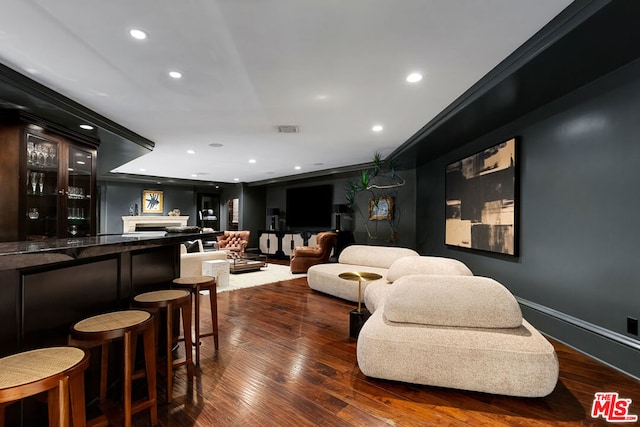 bar with dark hardwood / wood-style flooring