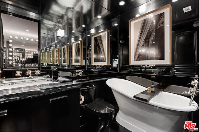 bathroom with vanity and a bathtub