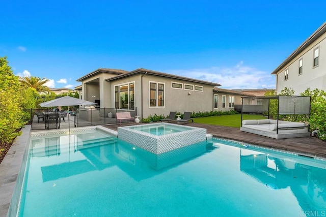 view of pool with a patio area and an in ground hot tub