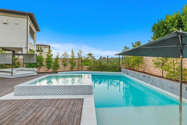 view of pool featuring a wooden deck