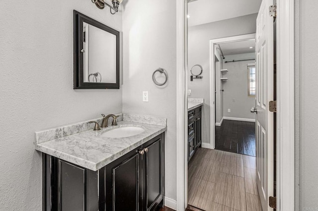 bathroom featuring hardwood / wood-style flooring and vanity