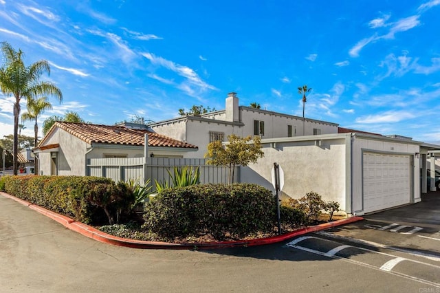 view of property exterior with a garage