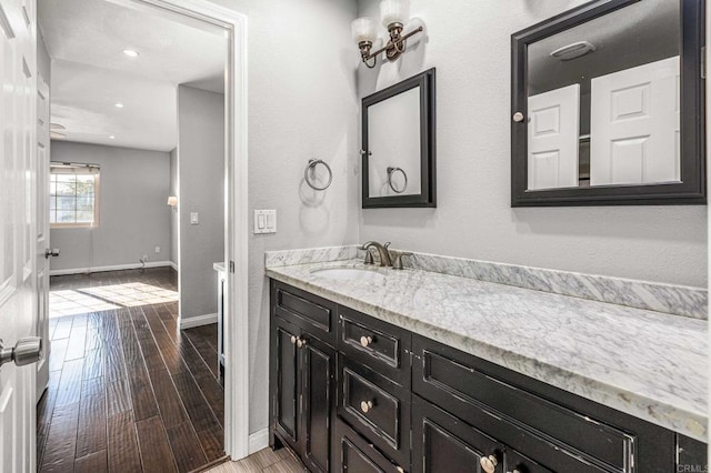 bathroom with vanity and hardwood / wood-style floors