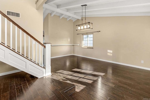 interior space with dark hardwood / wood-style flooring, high vaulted ceiling, and beamed ceiling