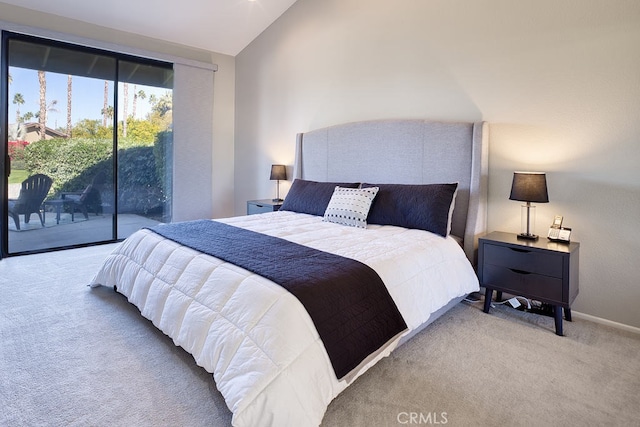 bedroom featuring lofted ceiling, carpet flooring, and access to outside