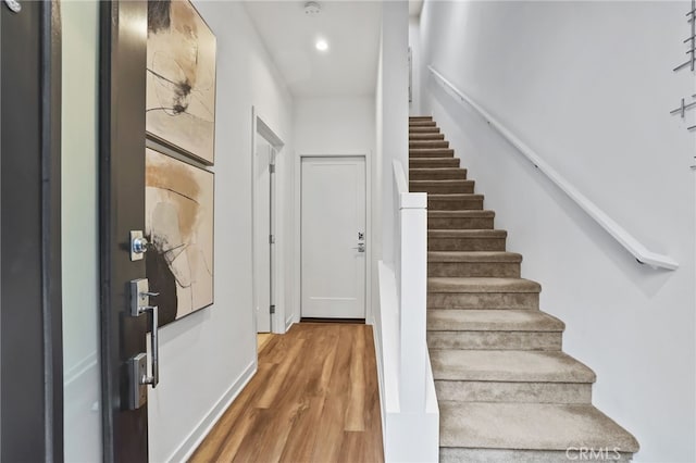 stairs with wood-type flooring