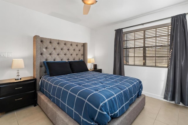 tiled bedroom with ceiling fan