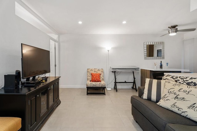 tiled living room featuring ceiling fan