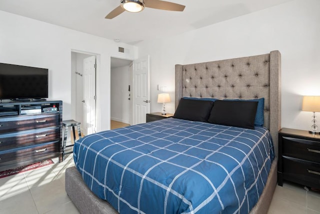 tiled bedroom with ceiling fan