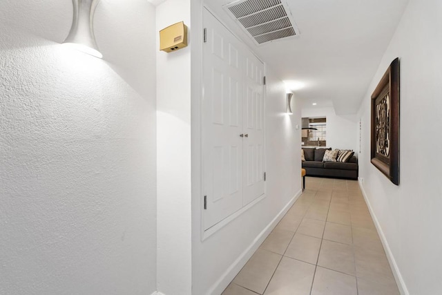 hallway with light tile patterned flooring