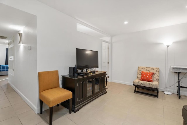 living area featuring light tile patterned flooring