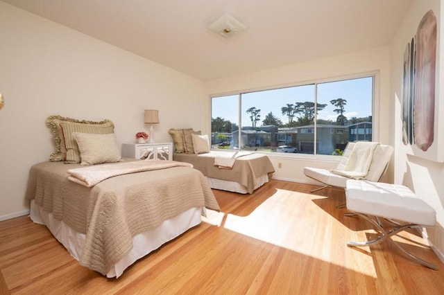 bedroom with hardwood / wood-style floors