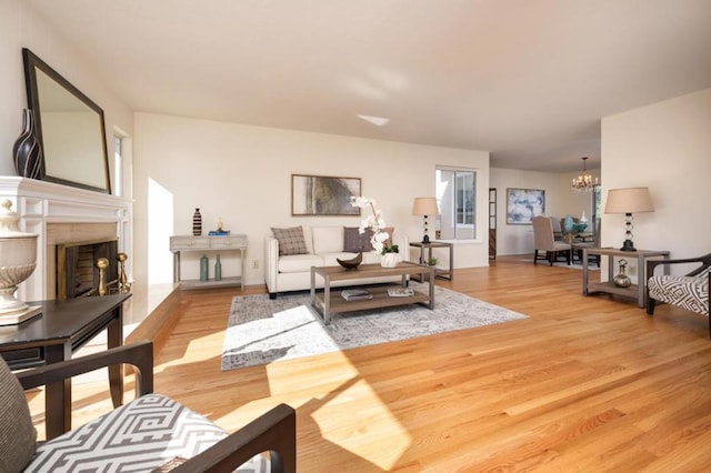 living room featuring wood-type flooring and a chandelier