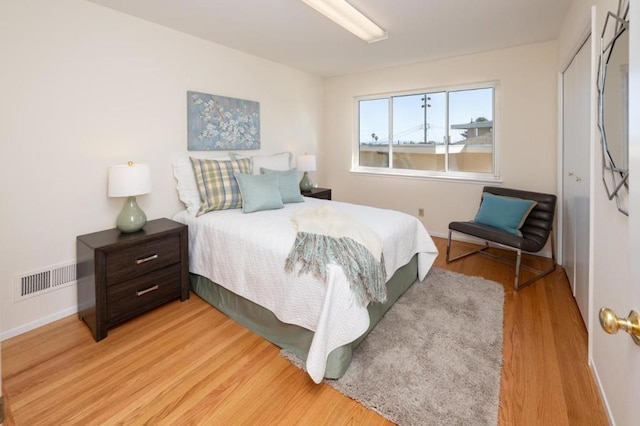 bedroom with light wood-type flooring