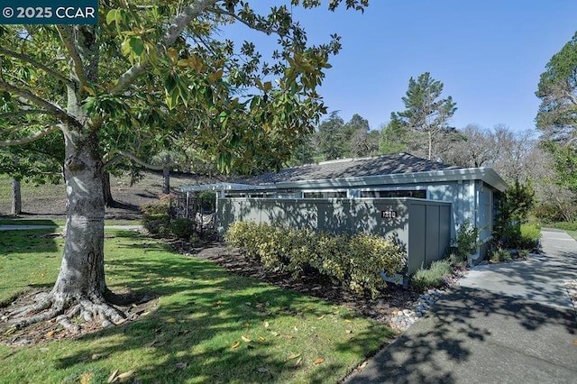 view of home's exterior with a lawn