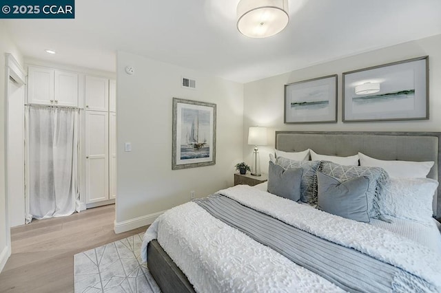 bedroom with light wood-type flooring