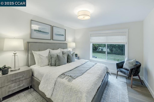 bedroom with light wood-type flooring