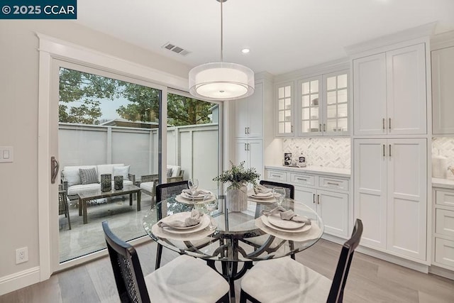 dining space featuring light hardwood / wood-style flooring