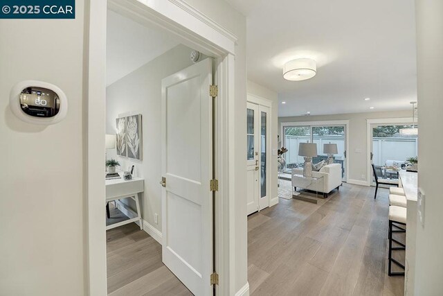 hallway featuring light wood-type flooring