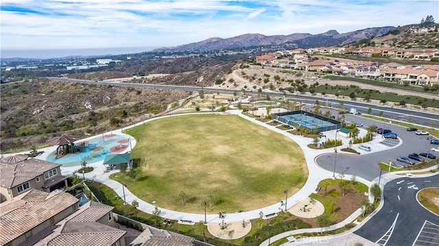 birds eye view of property with a mountain view