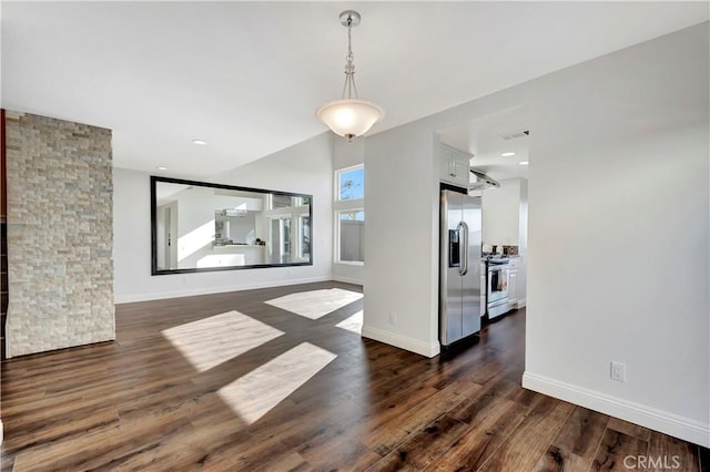 dining space with dark hardwood / wood-style floors