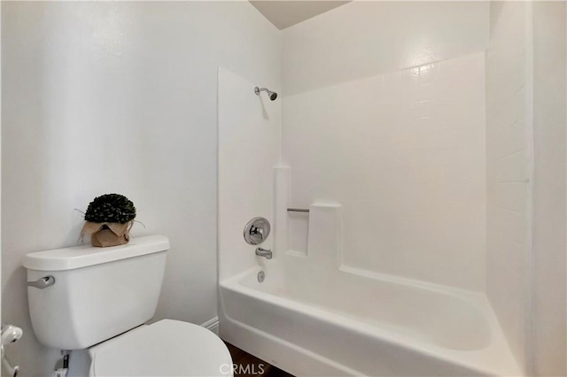 bathroom with shower / bathtub combination and toilet