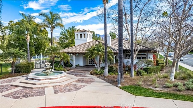 mediterranean / spanish-style house with a garage