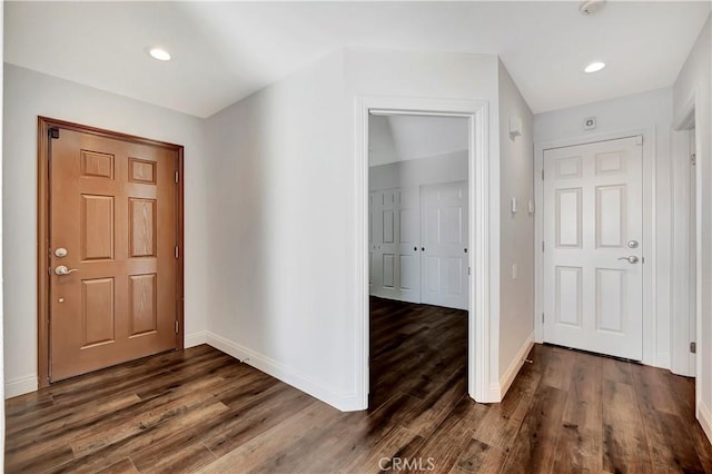 entrance foyer with dark hardwood / wood-style floors